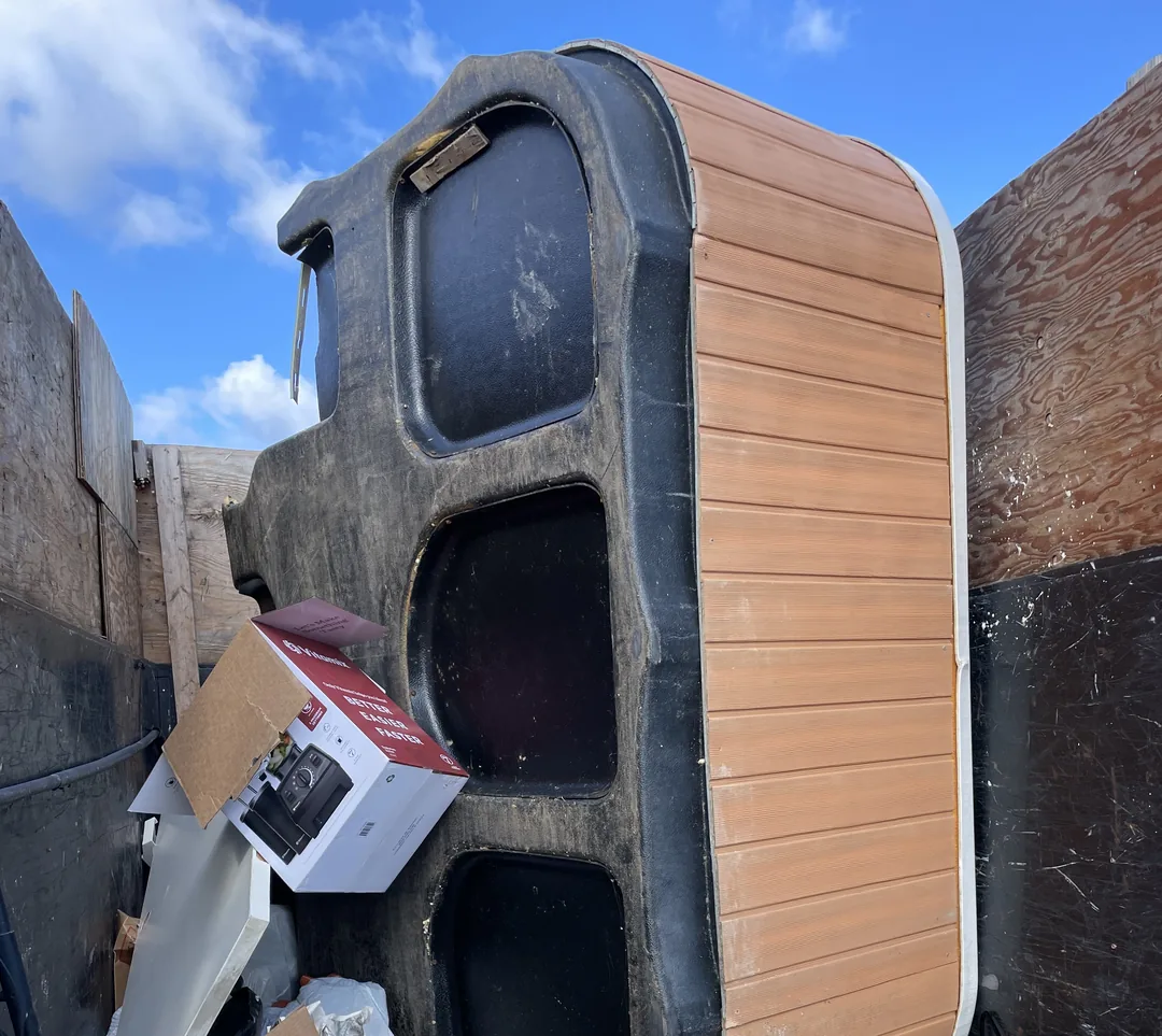 Hot tub loaded into the dump trailer after a teardown